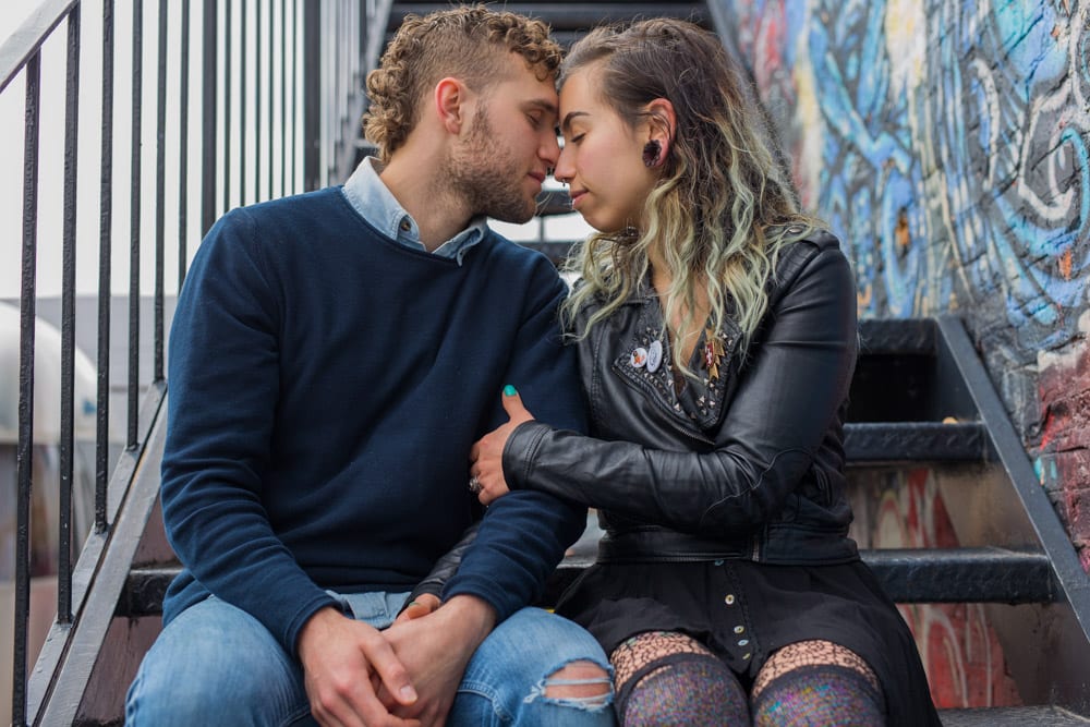 Logan Square couples session on staircase behind Milwaukee Avenue club