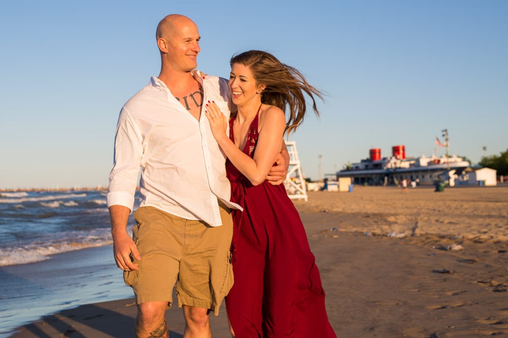 engaged couple on beach in summer