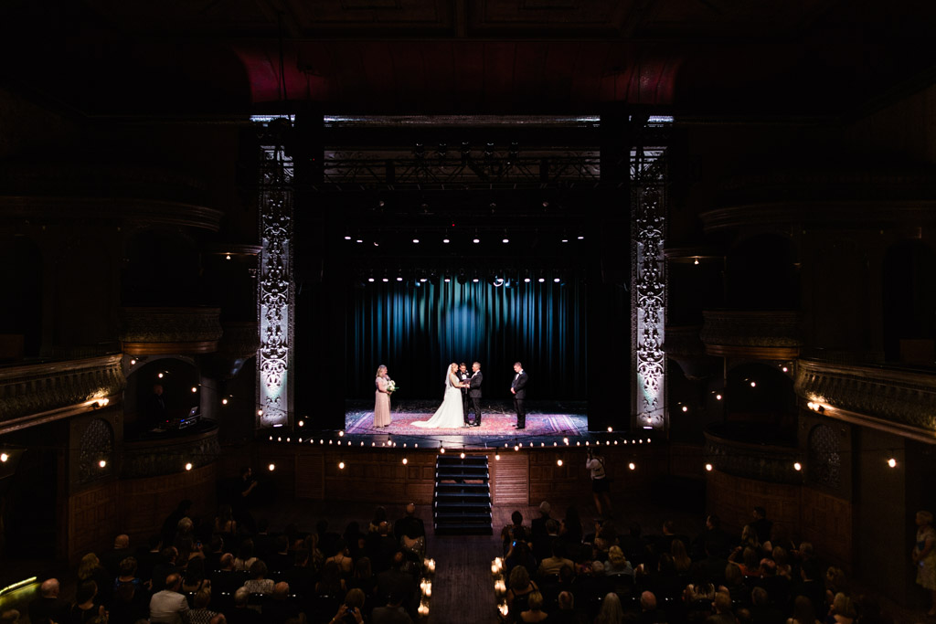 Historic Thalia Hall wedding ceremony of Chicago couple on stage