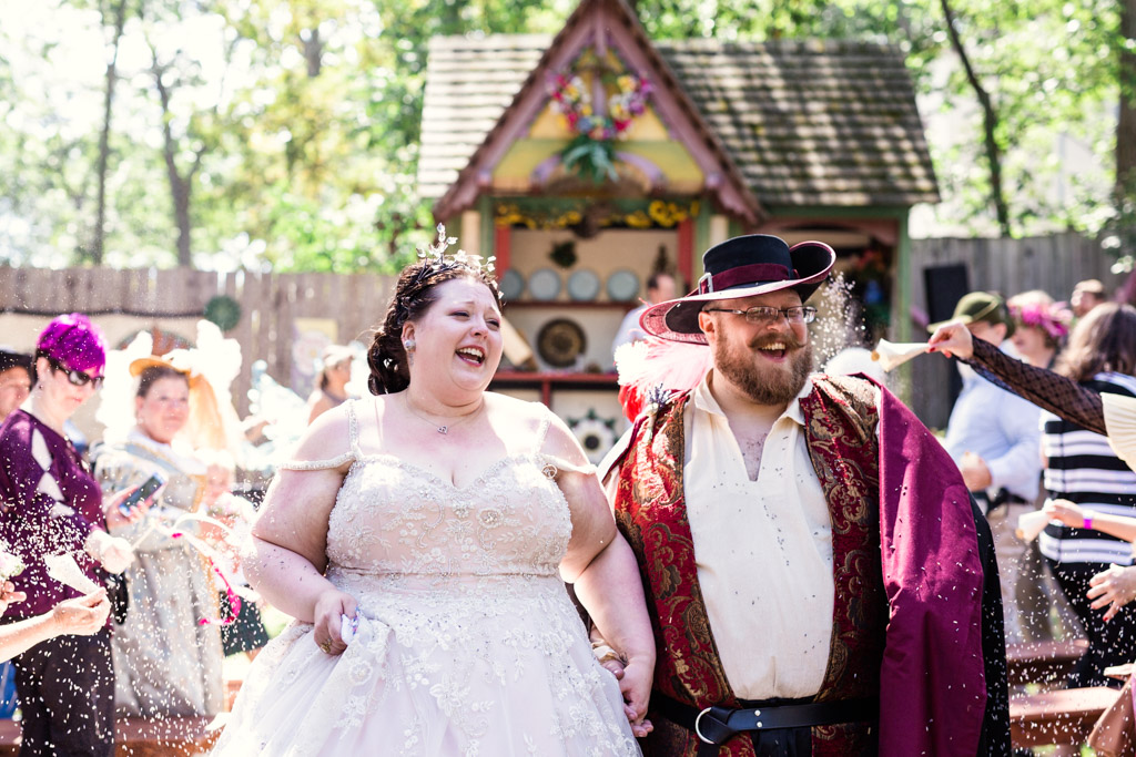 Guests toss lavender at bride and groom during their Bristol Renaissance Faire wedding ceremony