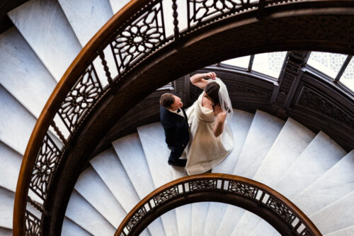 Bride and groom's first look at The Rookery staircase downtown Chicago