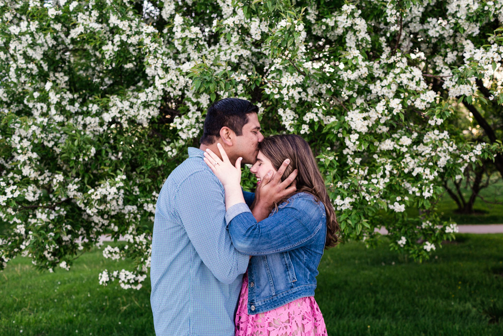 Chicago couple's Museum Campus engagement session at dusk with tree blossoms