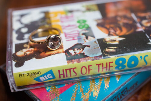 unique Chicago wedding photo of engagement ring on cassette tapes at Headquarters Beercade engagement session