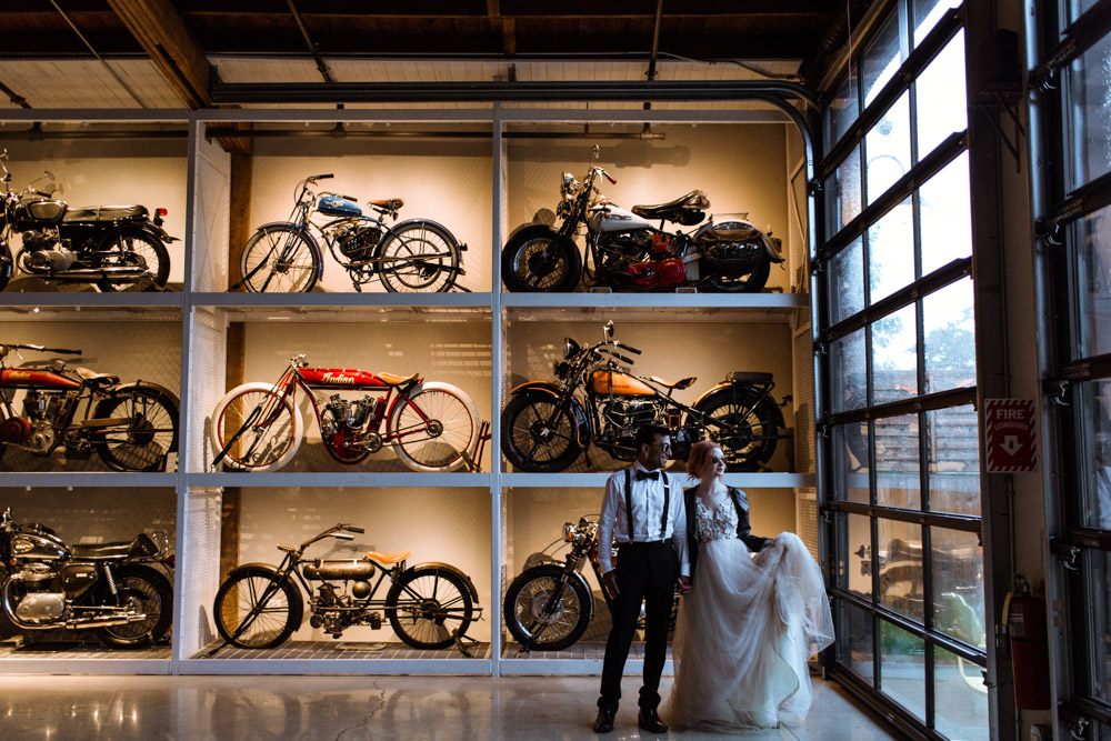 Warehouse 109 wedding with motorcycle wall edgy bride and groom with leather jacket