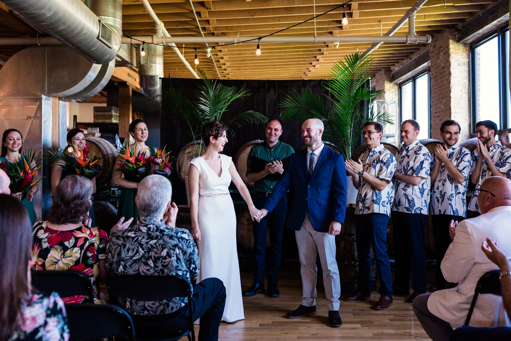 Chicago bride and groom at their Begyle Brewing wedding ceremony with tropical tiki theme