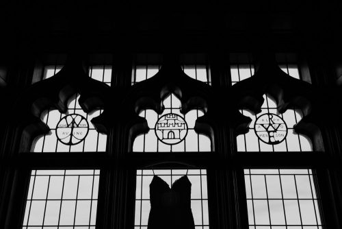 University Club of Chicago wedding dress silhouette hung in library window