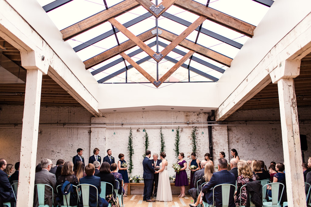 The Joinery Chicago wedding ceremony with skylight at Logan Square wedding venue