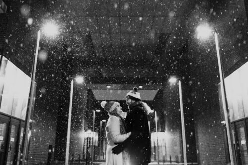 Chicago couple's UIC engagement session on a snowy evening at their alma mater