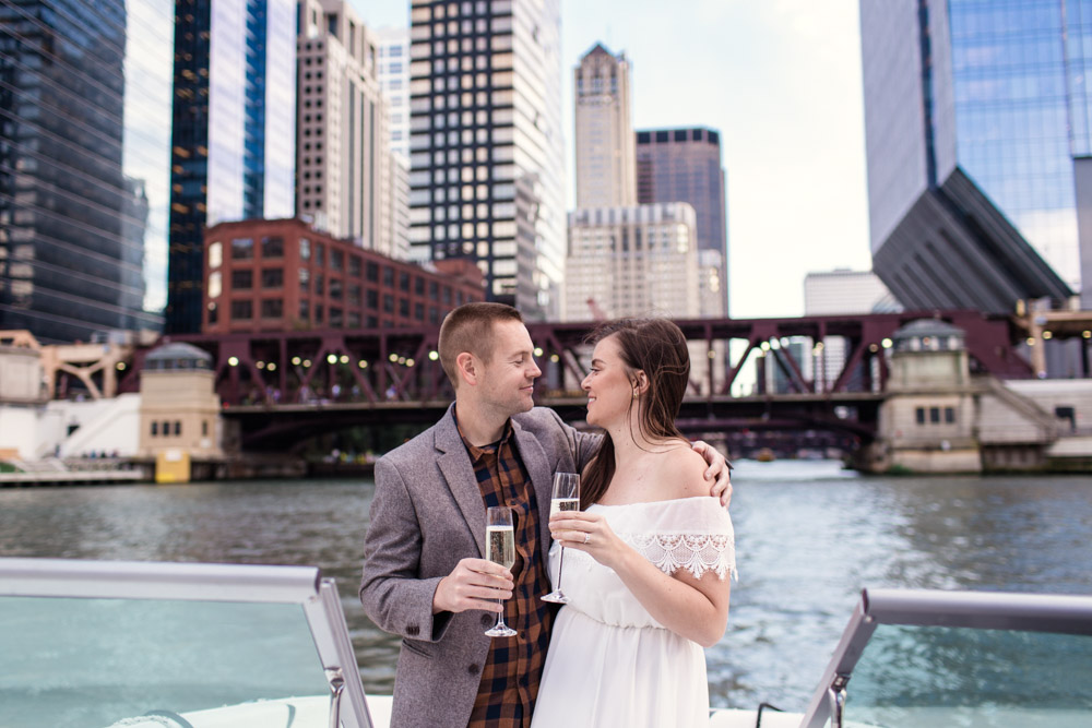 Chicago Riverboat engagement photo of couple with champagne