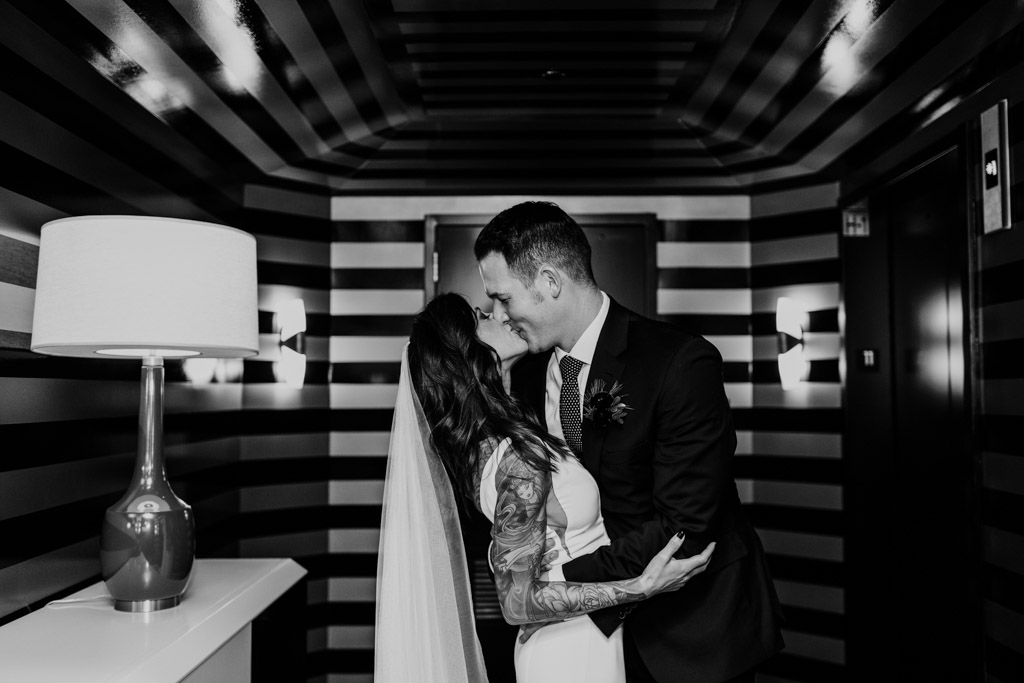Bride and groom kiss at Viceroy Hotel before their Chicago Gallery 1028 wedding