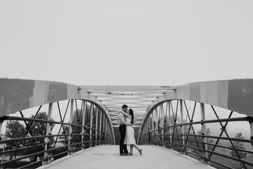 Artistic Lincoln Park engagement photo with bridge on foggy evening