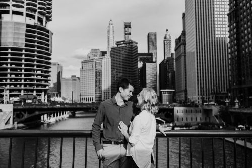 Candid Chicago engagement photo on downtown bridge