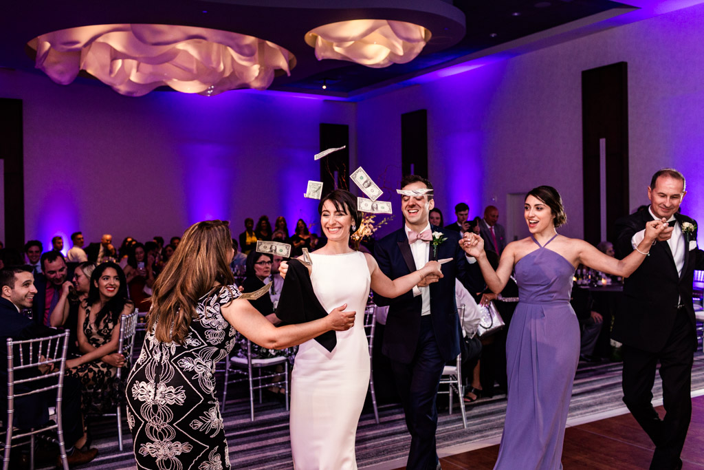 Traditional Greek Orthodox money dance at Loews Chicago wedding reception
