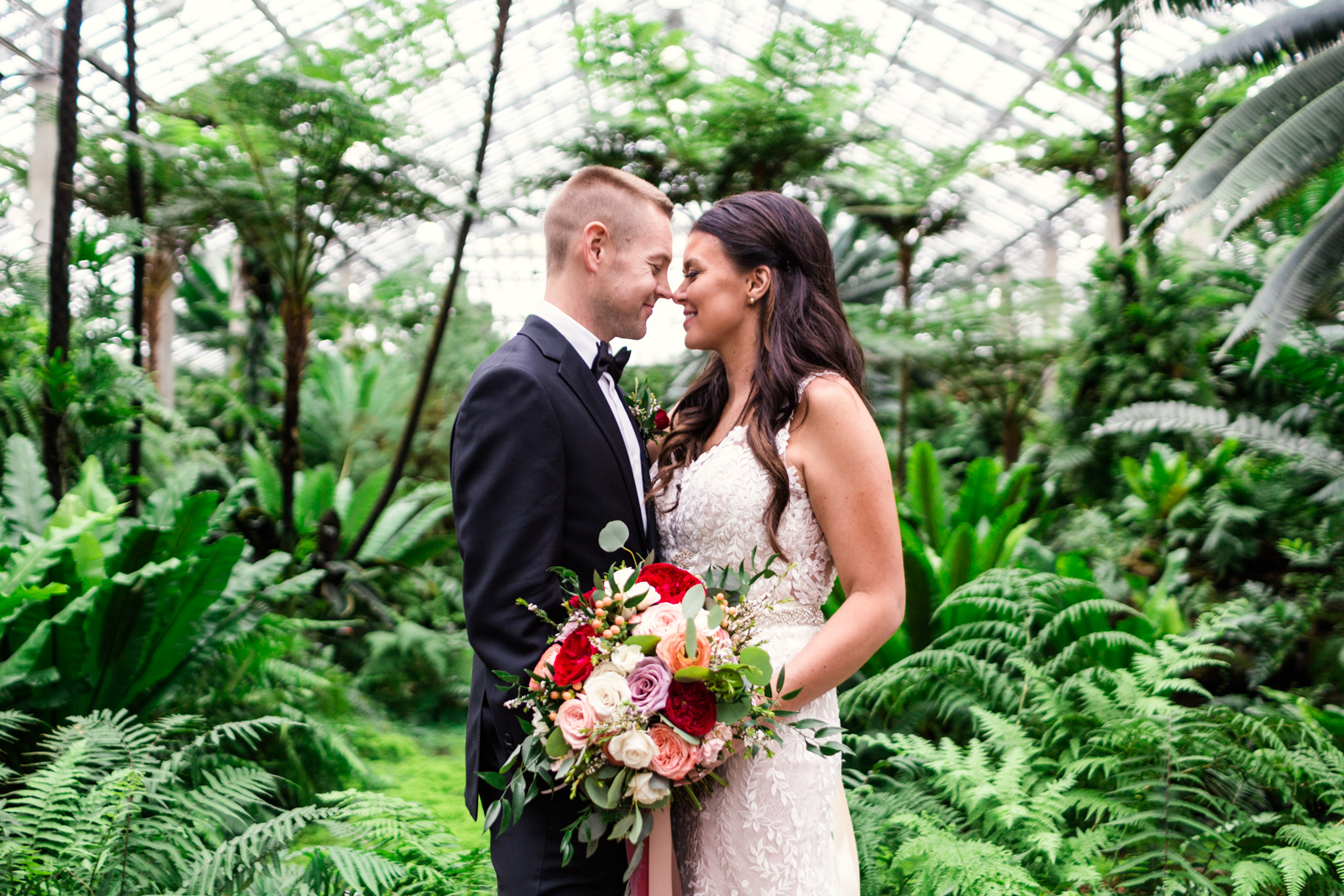 Bride and groom at Garfield Park Conservatory by documentary wedding photographer Emma Mullins Photography