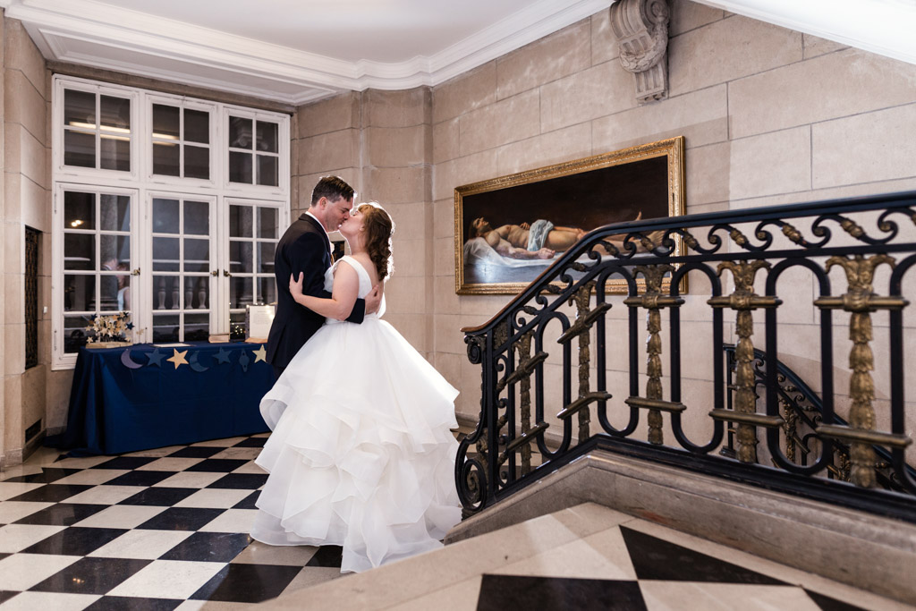 Chicago bride and groom kiss at their International Museum of Surgical Science wedding