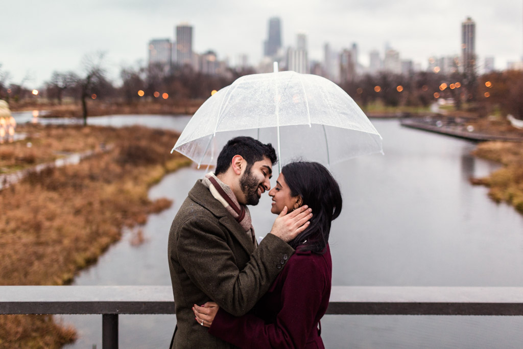 Surprise Lincoln Park proposal on rainy December day with Chicago skyline