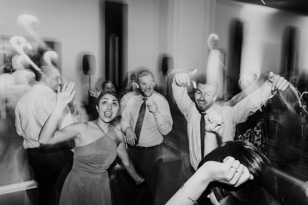 Guests celebrate on dance floor during Loews Chicago wedding reception