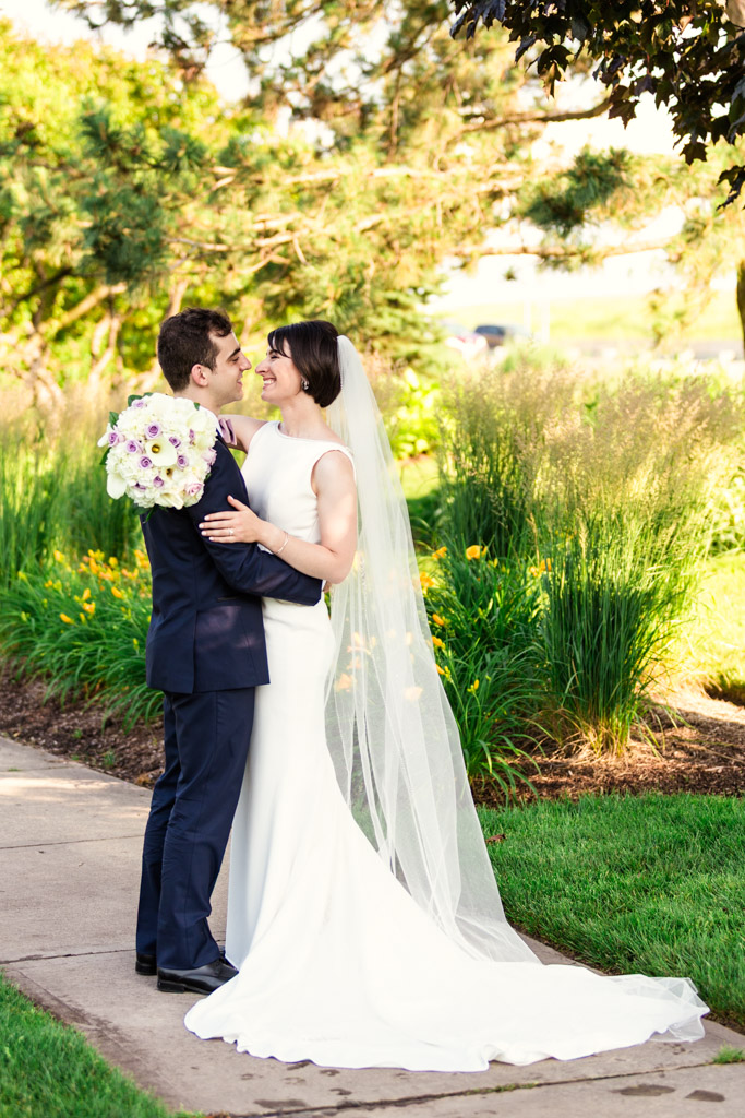 Happy bride and groom in garden before their Loews Chicago wedding reception