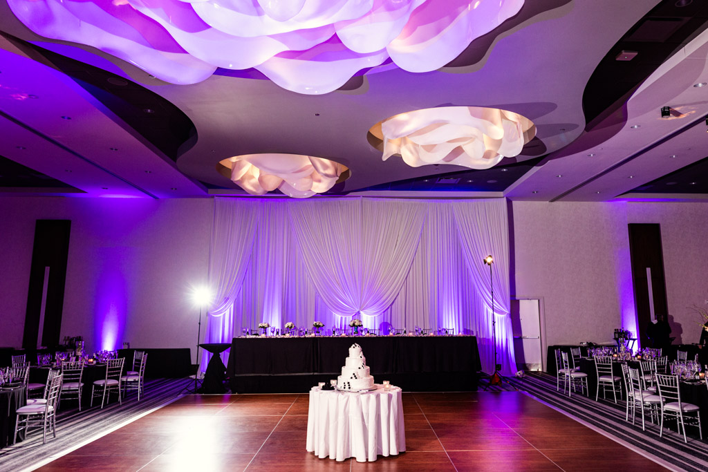 Loews Chicago wedding reception room shot with black and white cake on dance floor