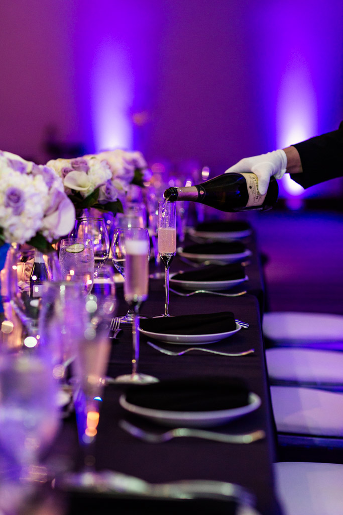 Loews Chicago wedding reception details of head table and champagne glasses