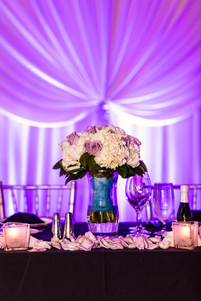 Bride's white and lavender bouquet on head table at Loews Chicago wedding reception