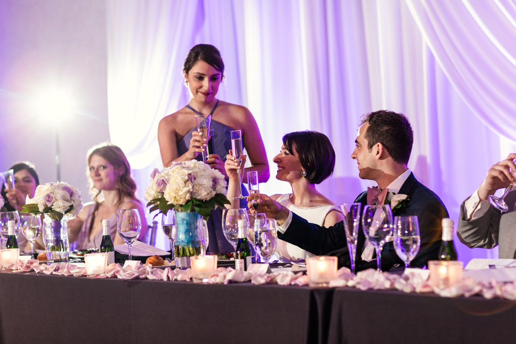Maid of Honor gives speech at head table during Loews Chicago hotel wedding reception