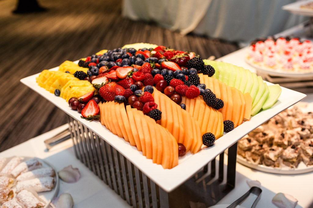 Colorful fruit plate on dessert table spread at summer Loews Chicago wedding reception