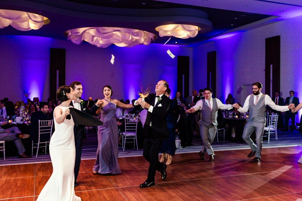 Wedding party performs traditional Greek dance during Loews Chicago wedding reception