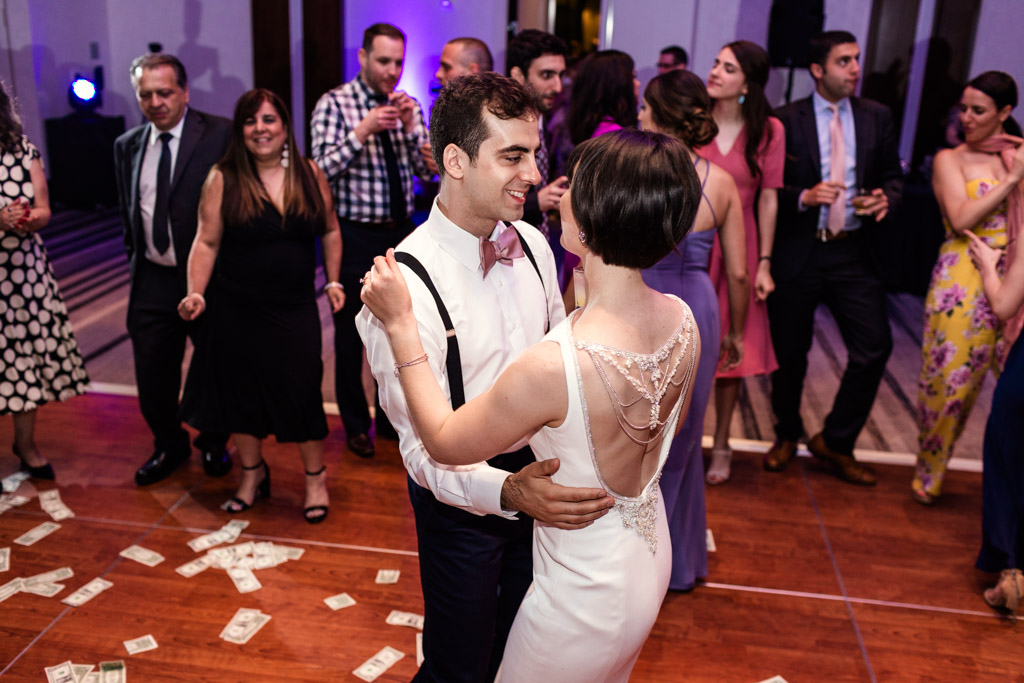 Bride and groom share a moment on dance floor during Loews Chicago wedding reception