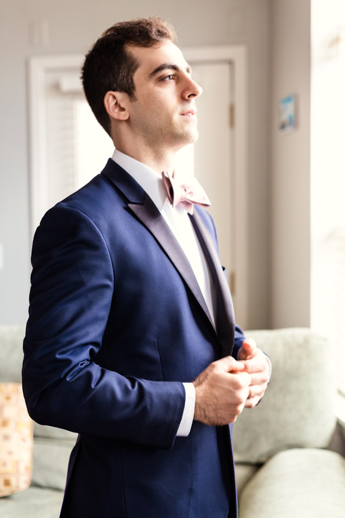 Chicago groom getting ready at home before Greek Orthodox wedding ceremony and reception at Loews Chicago hotel
