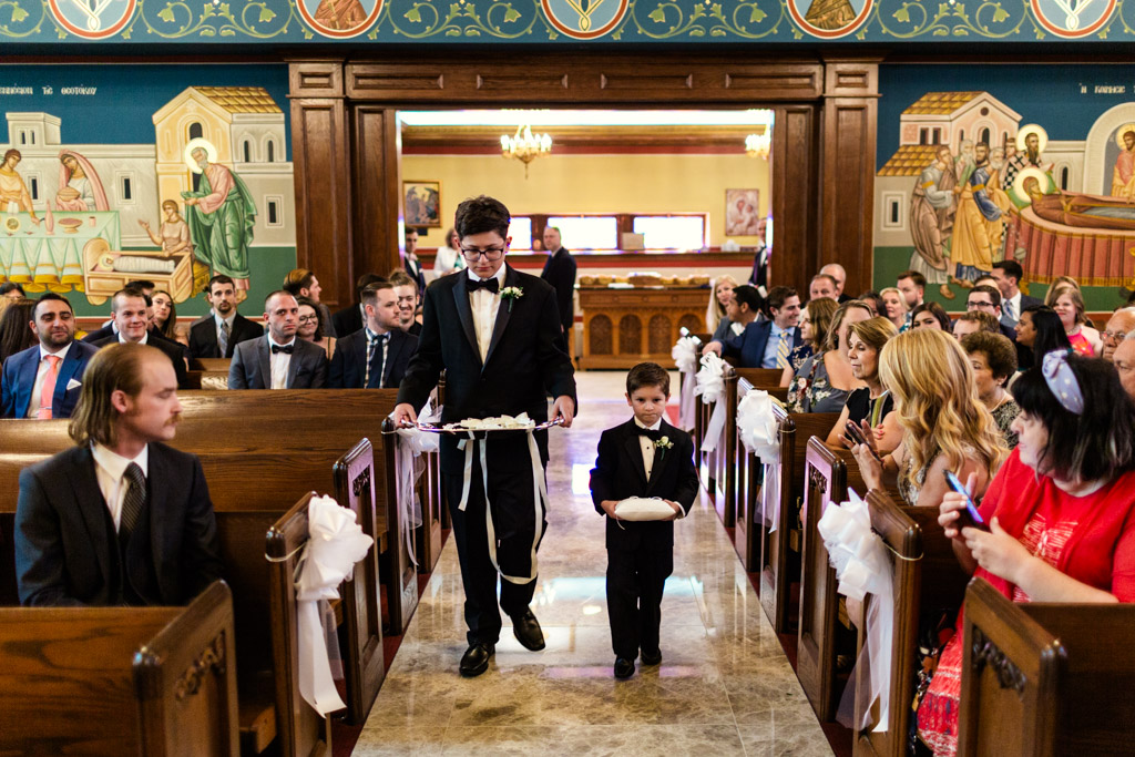 Ring and crown bearers walk down aisle to begin Chicago Greek Orthodox wedding ceremony