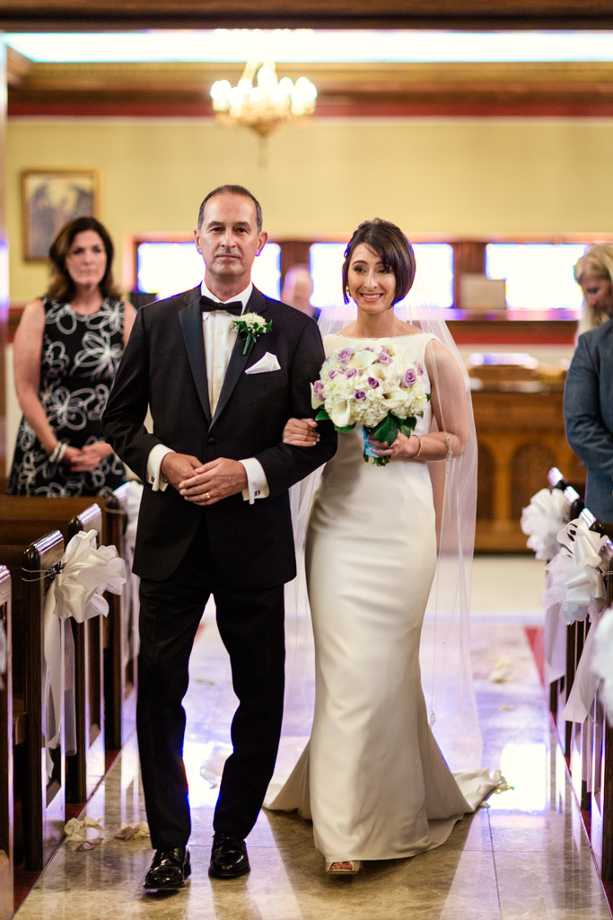 Bride and father enter Chicago Greek Orthodox wedding ceremony at St. George in Lincoln Park