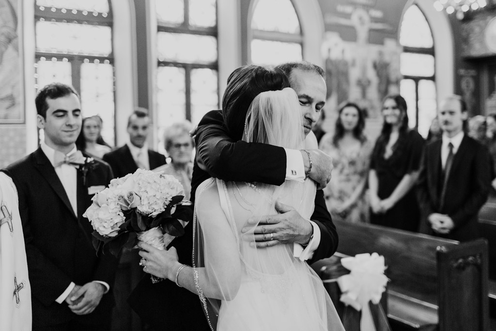 Father gives away bride at Chicago Greek Orthodox wedding ceremony at St. George in Lincoln Park