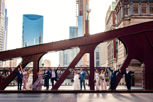 Fun River Roast Chicago wedding party photo on LaSalle Bridge