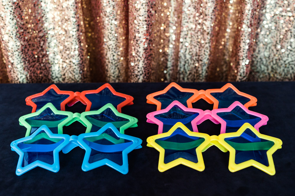 Chicago photo booth prop photo of oversized star shaped sunglasses in various colors by Emma Mullins Photography