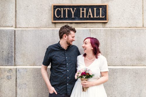 Candid Chicago City Hall elopement photo of bride and groom during summer 2020
