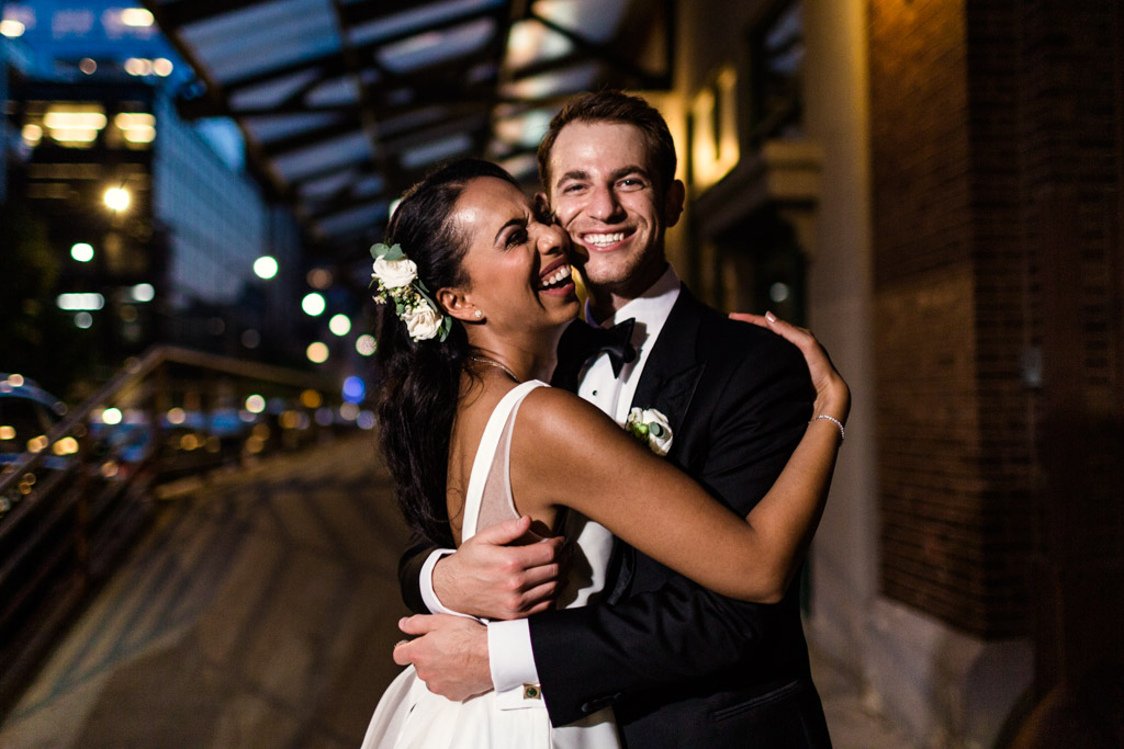 Night photo of happy Chicago newlyweds at their Loft Lucia Microwedding