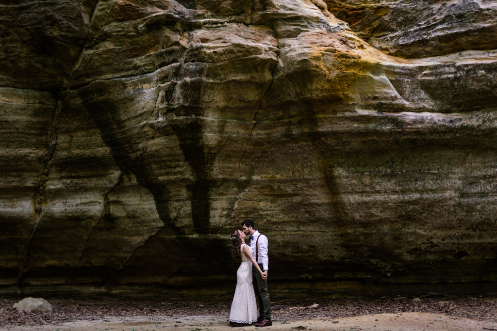 Bride and groom kiss at Illinois Canyon during after their intimate Starved Rock Lodge wedding