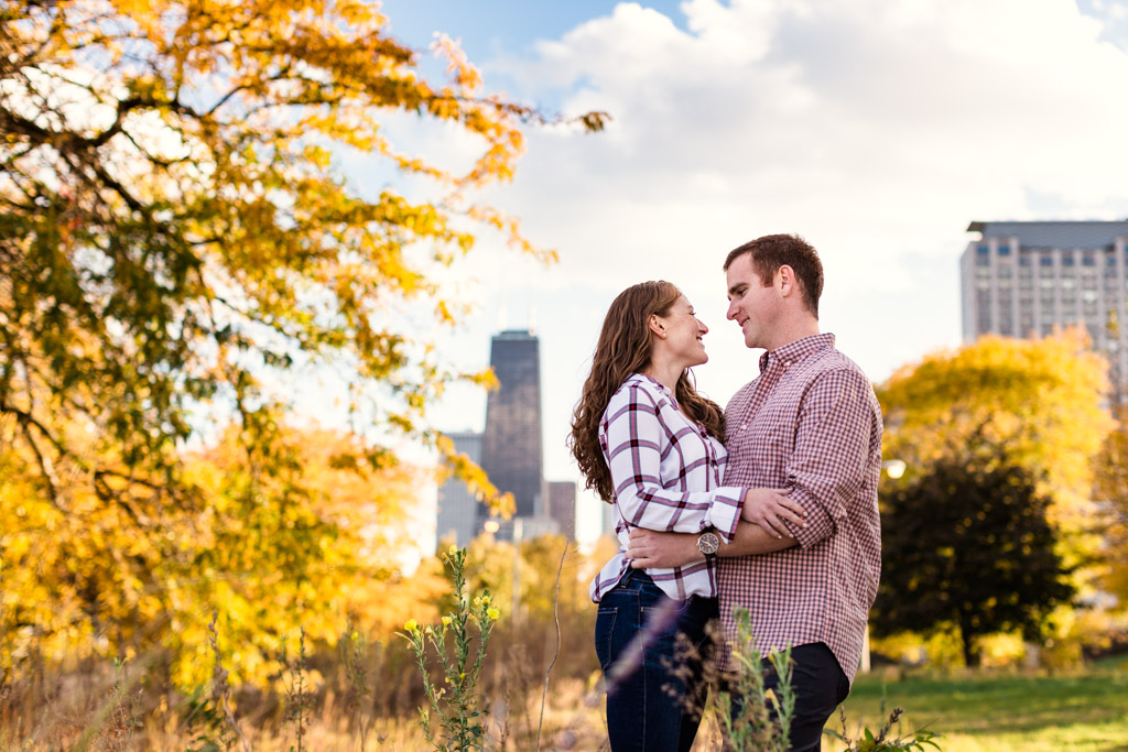 Fall Chicago engagement photo with colorful tree and skyline at Lincoln Park