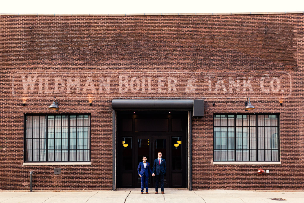 Just married groom and groom outside their styled Chicago loft wedding at Wildman Boiler & Tank Co.