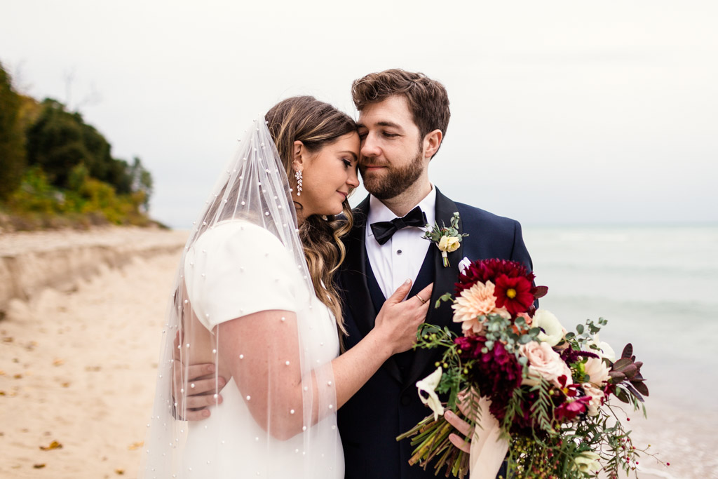 Romantic photo of bride and groom at their destination Michigan wedding in Union Pier