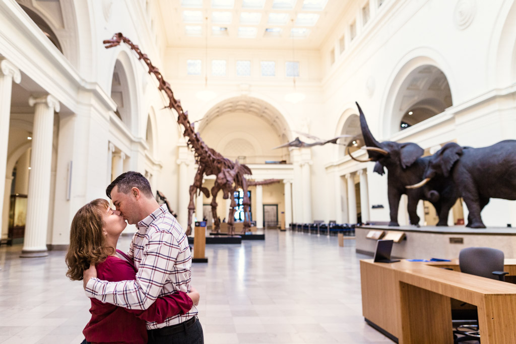Chicago Field Museum engagement session with dinosaurs and skyline view