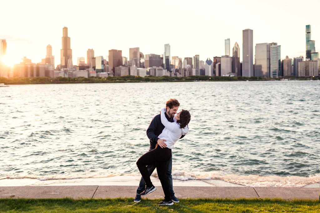 Romantic South Loop engagement photo of couple kissing with Chicago skyline