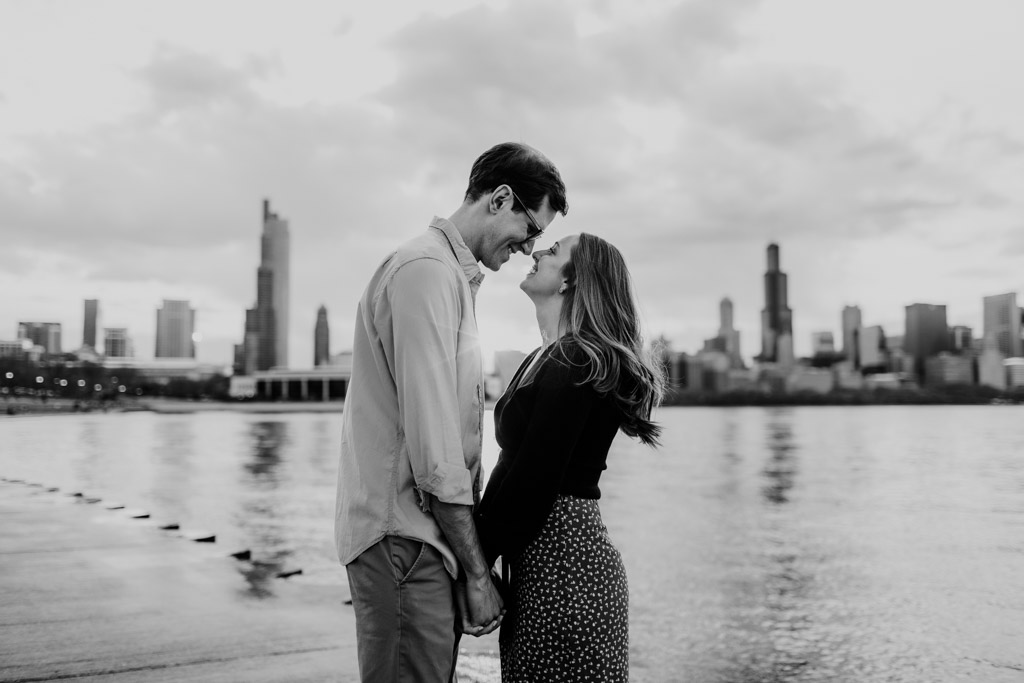 Romantic downtown spring engagement photo with Chicago skyline at lakefront
