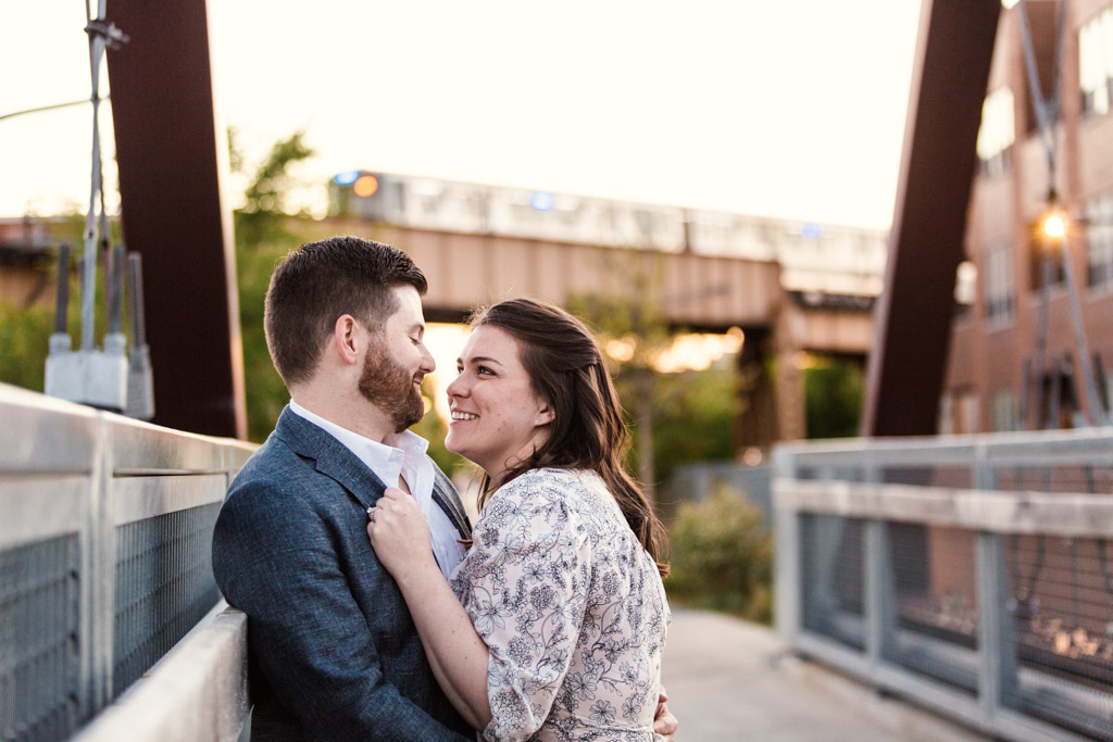 Happy couple stare into each other eyes on 606 path during Wicker Park engagement session