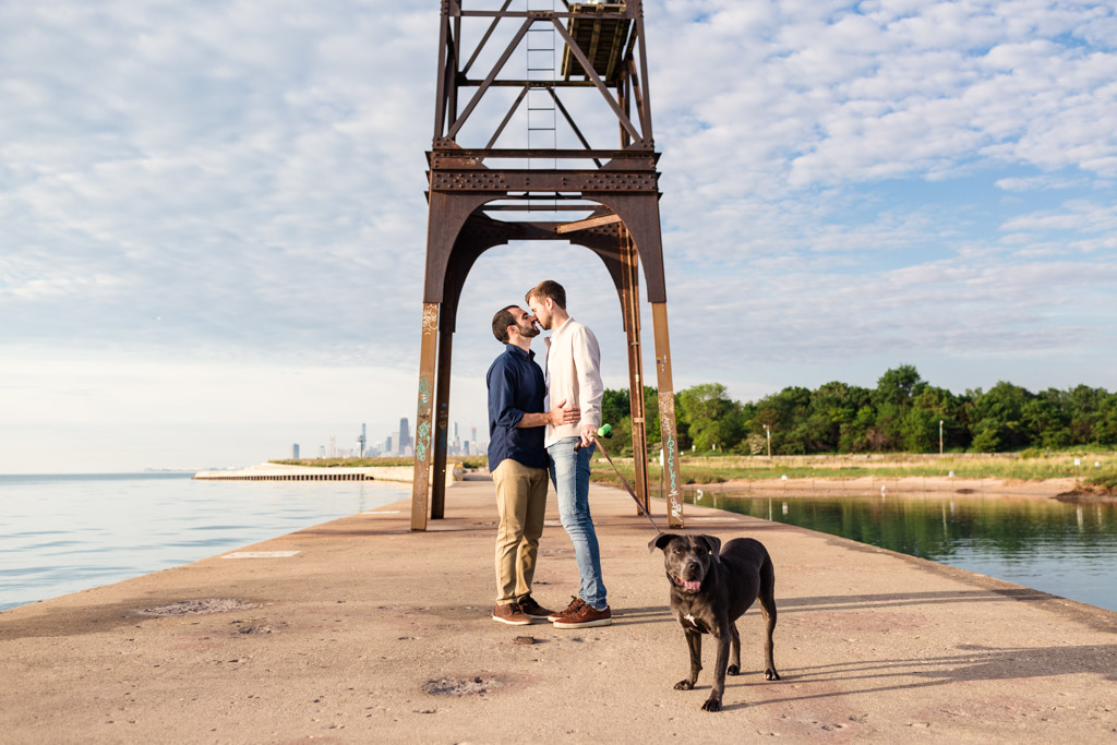 Montrose Harbor engagement photo with puppy on Lake Michigan pier