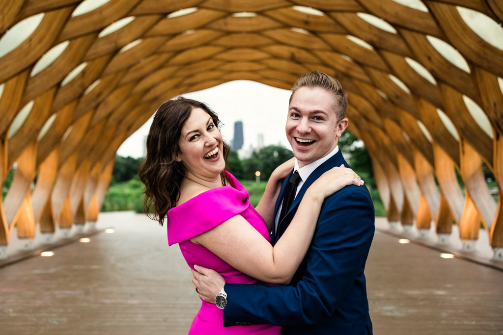 Candid summer Chicago engagement photo in Lincoln Park with honeycomb structure