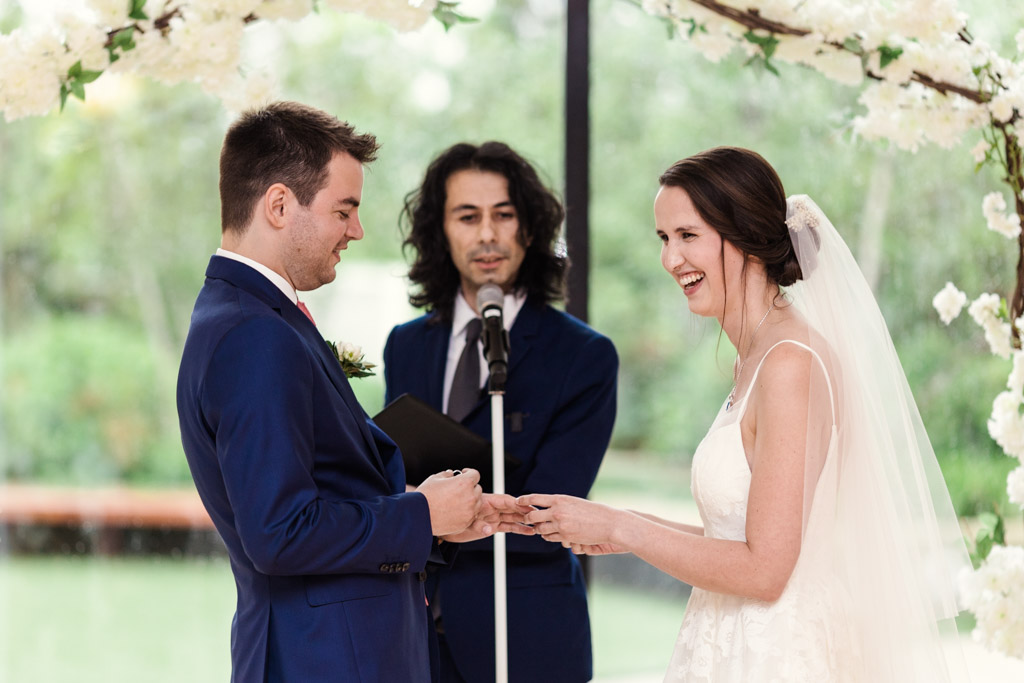 Bride and groom exchange vows during Greenhouse Loft wedding ceremony