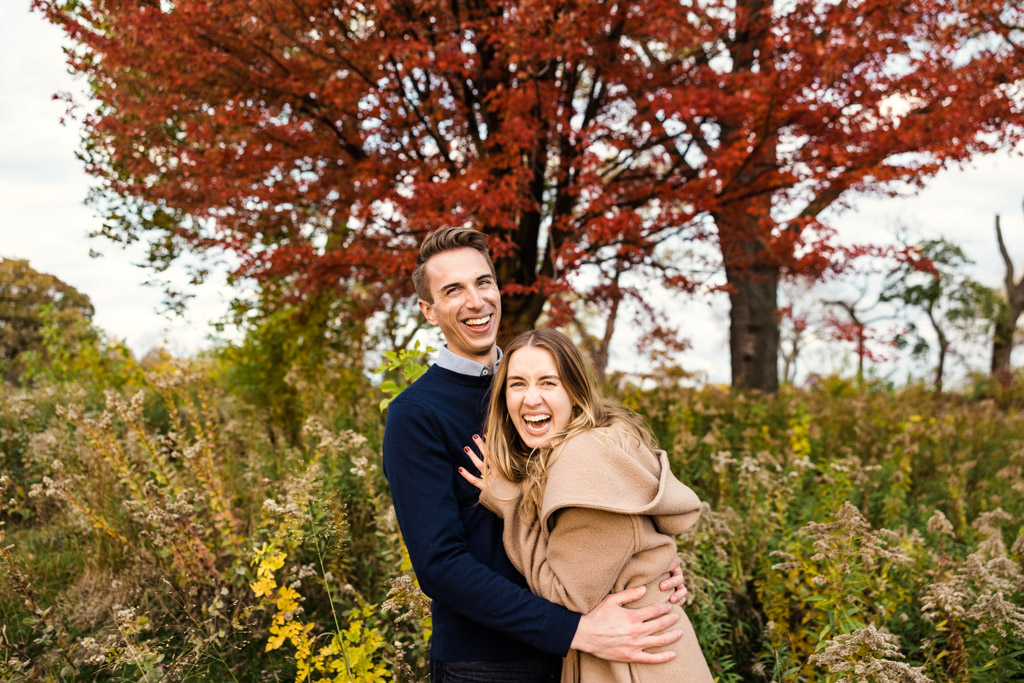 Chicago fall engagement photo of couple laughing in Lincoln Park