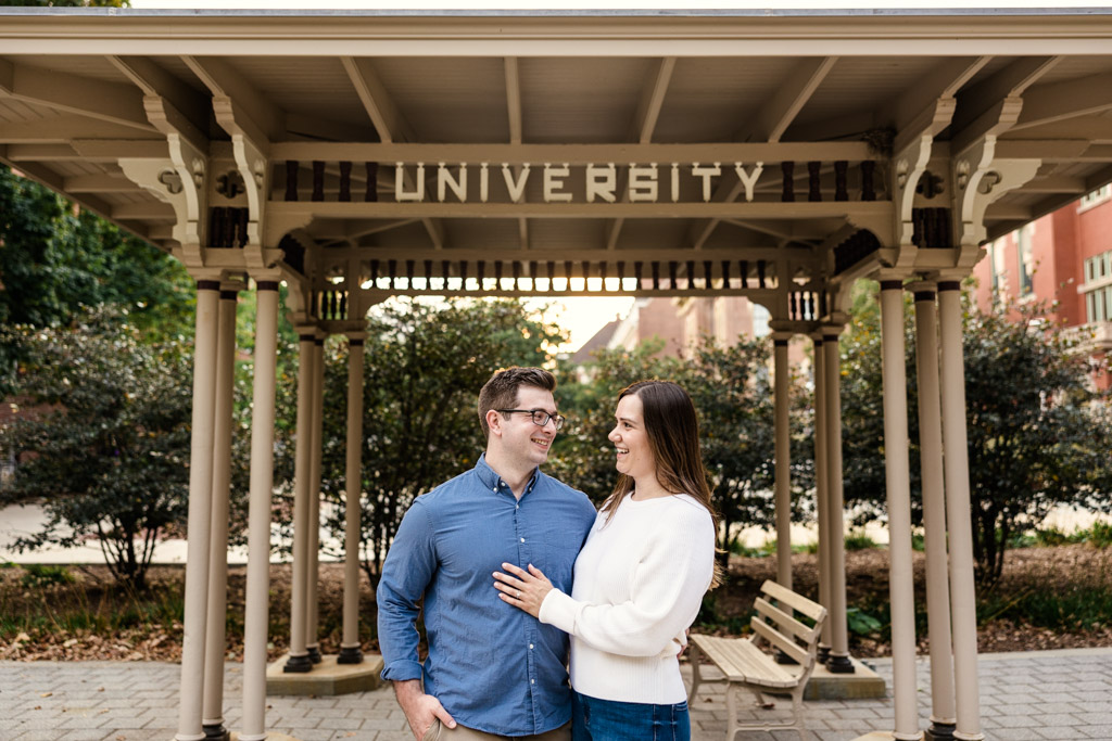 Champaign engagement photo of couple smiling on University of Illinois campus